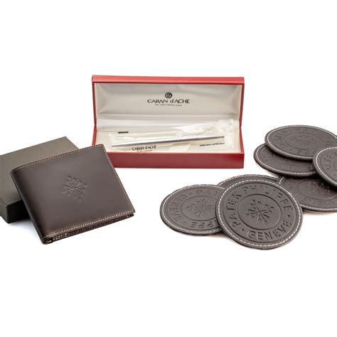 Patek Philippe coasters (6) with box and paper describing each